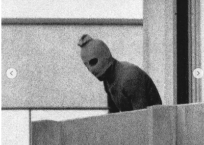 Munich Olympics masked terrorist peering from balcony